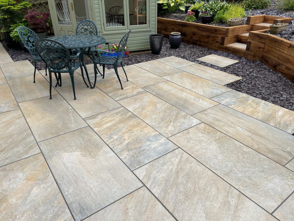 After image of landscaped garden with patio, planting beds and seating area